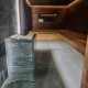 Чугунная банная печь «Атмосфера L» в облицовке из натурального камня до 20 м³